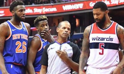 Referee Eric Lewis steps in between Washington Wizards forward Markieff Morris (5) and New York Knicks center Mitchell Robinson after a verbal altercation in the second quarter of the Knicks' 124-121 preseason win at Capital One Arena in D.C. on Oct. 1. (John De Freitas/The Washington Informer)