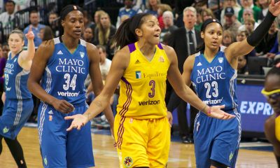 Candace Parker of the Los Angeles Sparks surrounded by the Minnesota Lynx
