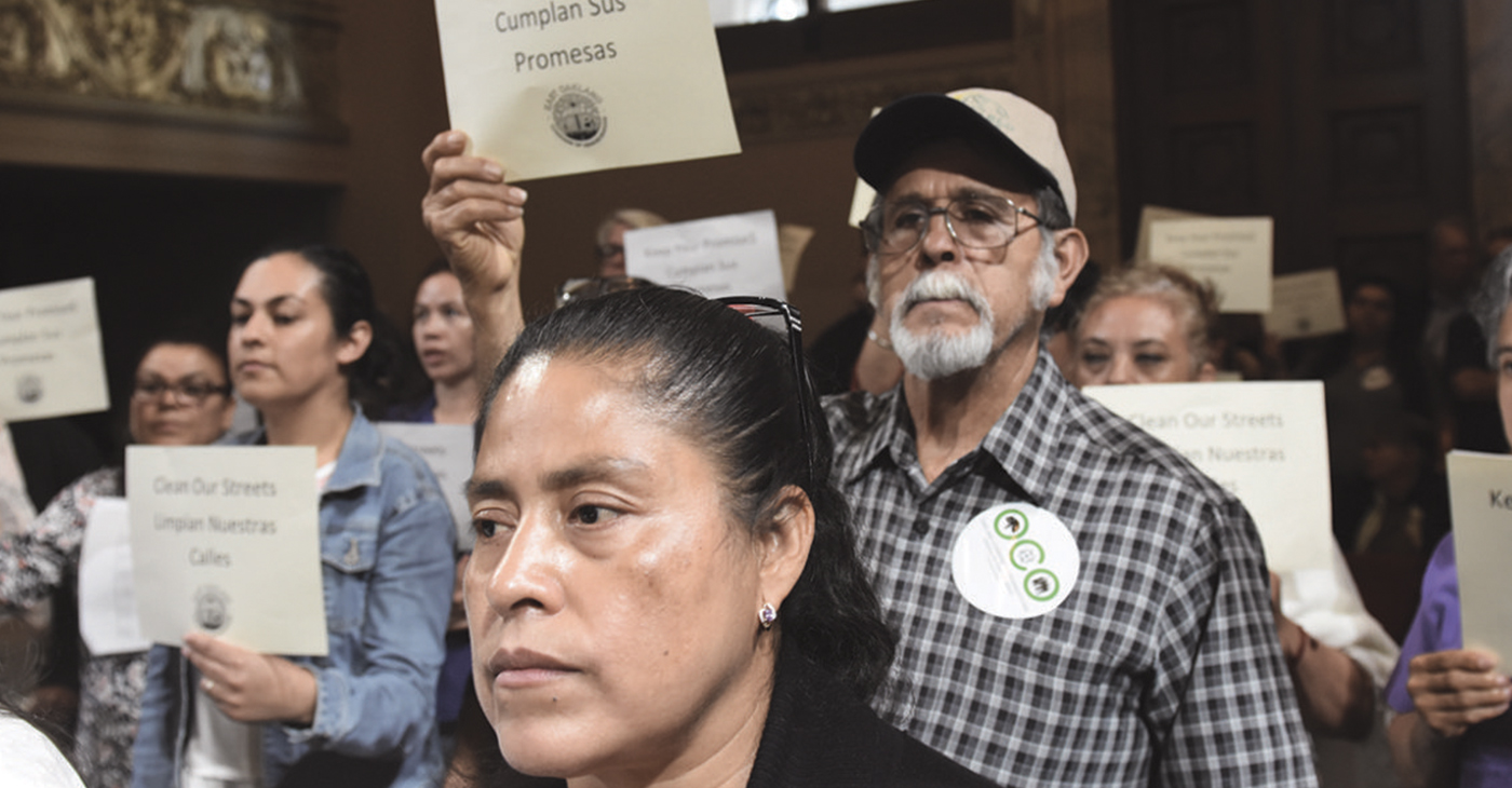 Members of East Oakland Congress of Neighborhoods rally at City Hall to demand  the city keep its promises to clean up trash and illegal dumping. Photo by Ken Epstein.