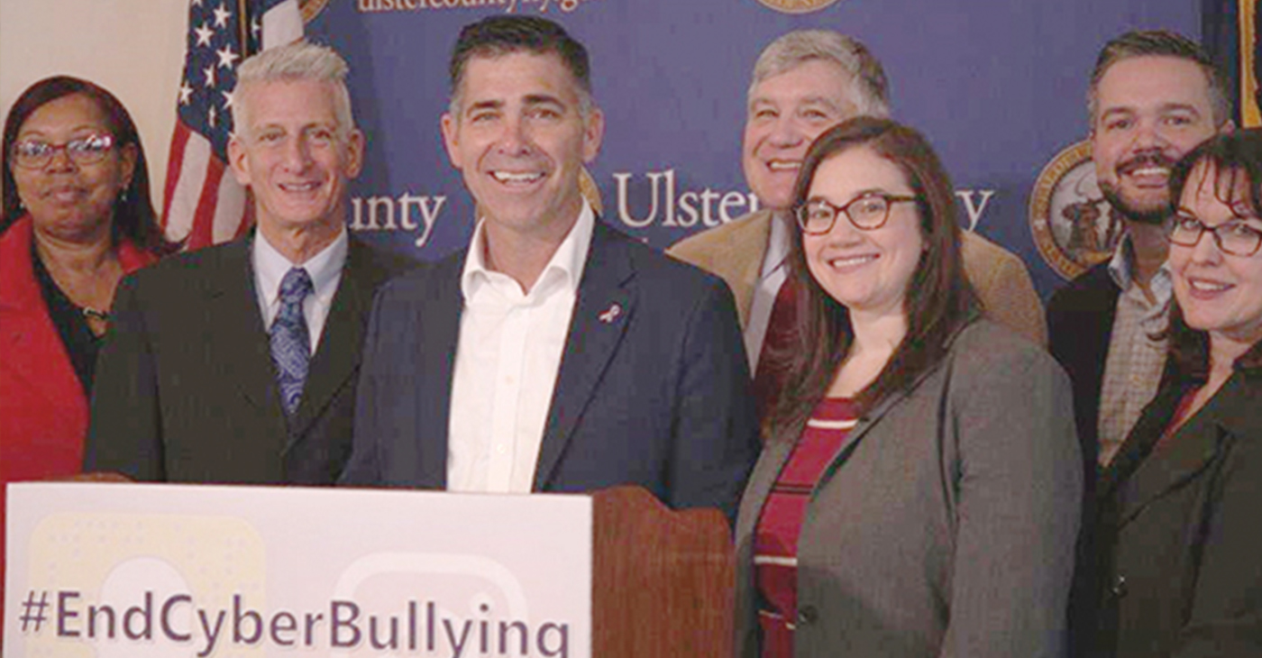 Activist Jeff Rindler and Ulster County Executive Michael Hein (2nd & 3rd from left) in solidarity with the awareness campaign pose for a photo as they announced a social media campaign, #EndCyberBullying.