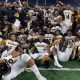 Detroit King football celebrates its third state title in four years.