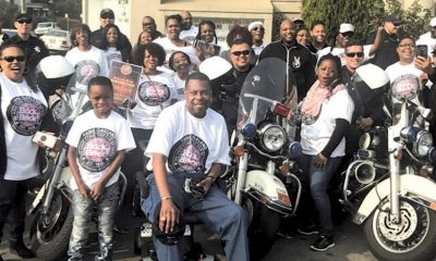 Pastor Harold Mayberry, the Senior Pastor at FAME (front) with Oakland police officers and members of the FAME community.