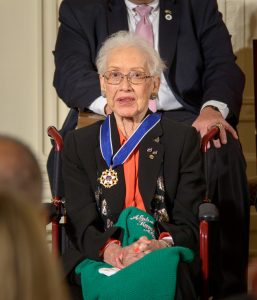Former NASA mathematician Katherine Johnson is seen after President Barack Obama presented her with the Presidential Medal of Freedom, Tuesday, Nov. 24, 2015, during a ceremony in the East Room of the White House in Washington. Photo Credit: (NASA/Bill Ingalls) Johnson's computations have influenced every major space program from Mercury through the Shuttle program. Johnson was hired as a research mathematician at the Langley Research Center with the National Advisory Committee for Aeronautics (NACA), the agency that preceded NASA, after they opened hiring to African-Americans and women. Johnson exhibited exceptional technical leadership and is known especially for her calculations of the 1961 trajectory for Alan Shepard’s flight (first American in space), the 1962 verification of the first flight calculation made by an electronic computer for John Glenn’s orbit (first American to orbit the earth), and the 1969 Apollo 11 trajectory to the moon. In her later NASA career, Johnson worked on the Space Shuttle program and the Earth Resources Satellite and encouraged students to pursue careers in science and technology fields.