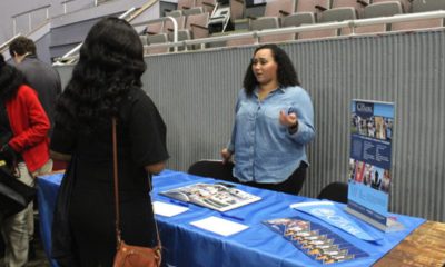 Lieutenant Teisha Neitz, admissions officer, The Citadel in Charleston, S.C. speaks with student during college fair. (Ameera Steward Photo, The Birmingham Times)