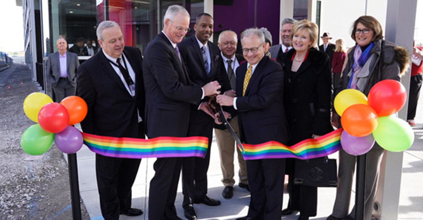 BNA president/CEO, Doug Kreulen, is joined by BNA Board of Commissioners Chair Dr. A. Dexter Samuels, and Mayor David Briley, in cutting the ribbon for the new Parking and Transportation Center at Nashville International Airport.