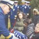 Rear Adm. Andrew Tiongson, commander First Coast Guard District, passes a folded American flag to a family member during funeral services for Dr. Olivia Hooker in White Plains, New York, Dec. 5, 2018. Dr. Hooker was the first African-American woman to enlist in the Coast Guard. Photo: Petty Officer 3rd Class Steve Strohmaier