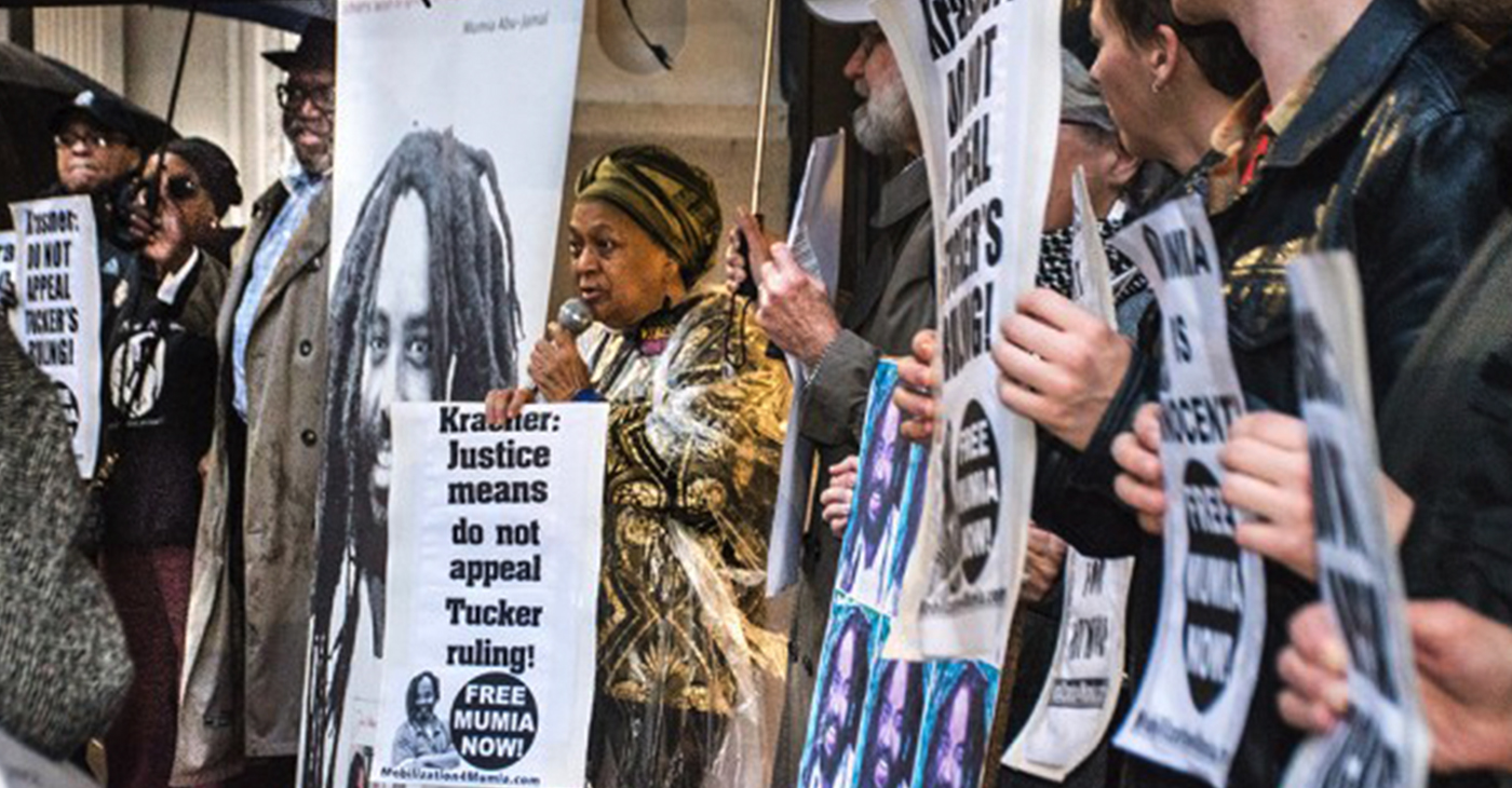 Pam Africa, head of International Concerned Friends and Family of Mumia Abu-Jamal, tells Philadelphia DA Larry Krasner at a rally Friday to do the right thing and let Judge Tucker’s ruling stand. Krasner was elected in a wave that replaced DAs around the country who slavishly obey police unions like Philly’s Fraternal Order of Police that call Mumia a cop-killer and rig the system against him with DAs who work for the people. Sign the petition to amplify Pam Africa’s demand that Krasner NOT appeal Judge Tucker’s ruling.