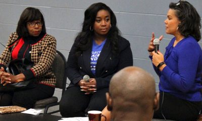 Carolyn King Arnold (at left) and Keyaira D. Saunders (middle) respond to questions from event moderator Cydney Walker during a forum held at the Moorland Family YMCA Tuesday night. The two are vying to replace Dwaine Caraway at the District 4 seat on the Dallas City Council. (Photo: David Wilfong)