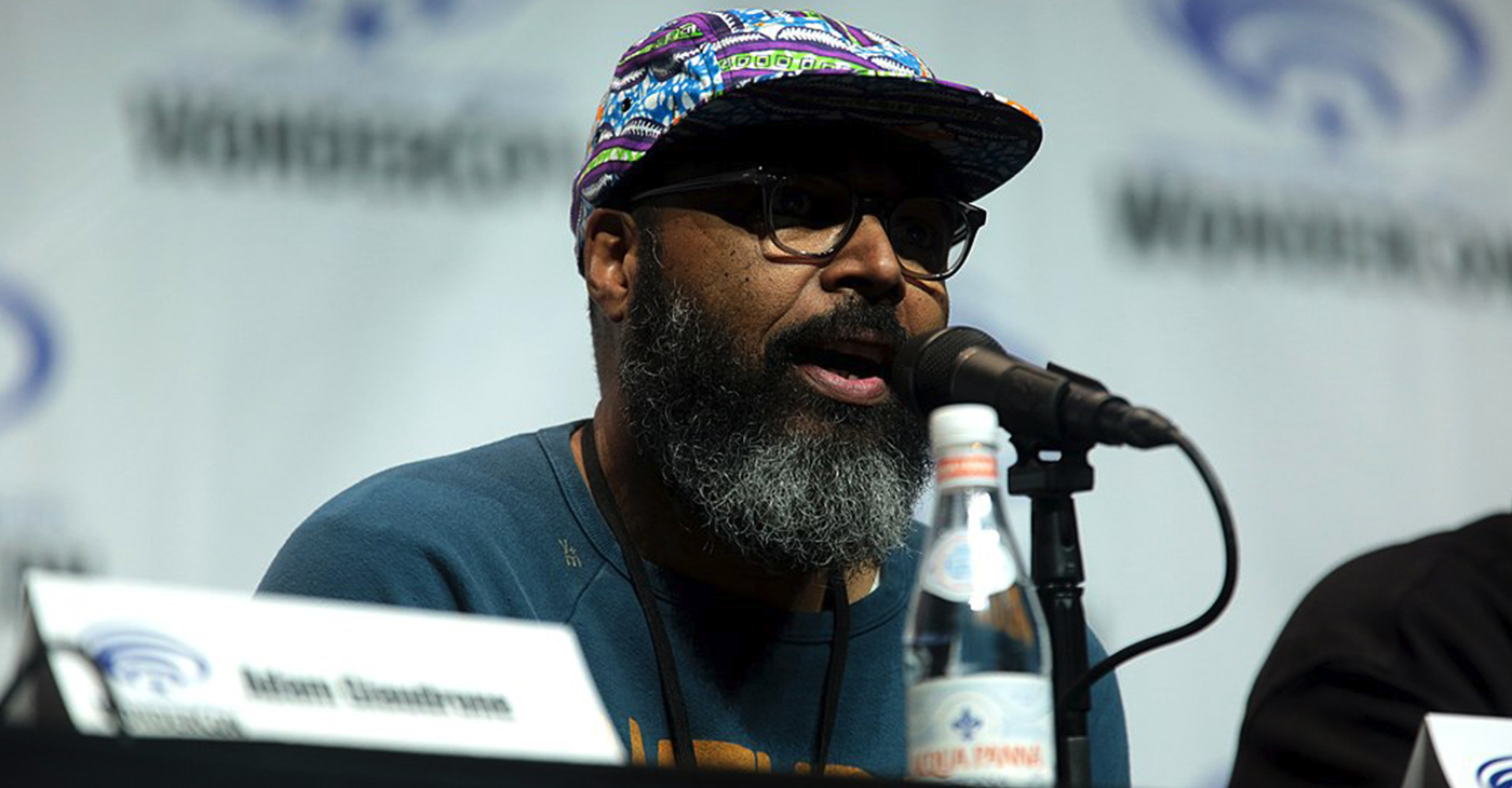 Salim Akil speaking at the 2018 WonderCon, for "Black Lightning", at the Anaheim Convention Center in Anaheim, California