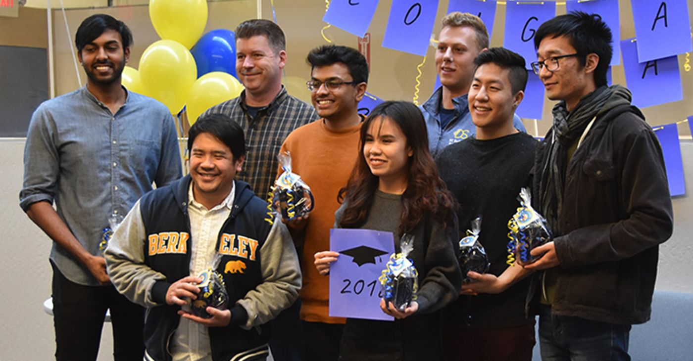 Eight of the nine data science majors who graduated December 15 gathered in the Division of Data Sciences on December 14 to celebrate their achievement. From left: Jeevan Reddy Mokkala, Emanuel Lucban, Adam Osborn, Nikhil Krishnan, Thao Vo, Alexander Ivanoff, Liam Shi and Howe Cui. Not pictured: Ting Chih Lin.