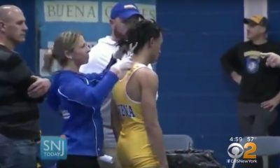 A referee told a wrestler in Buena that he couldn't participate in a match unless he snipped his hair. (Photo: Screen capture CBS/YouTube)