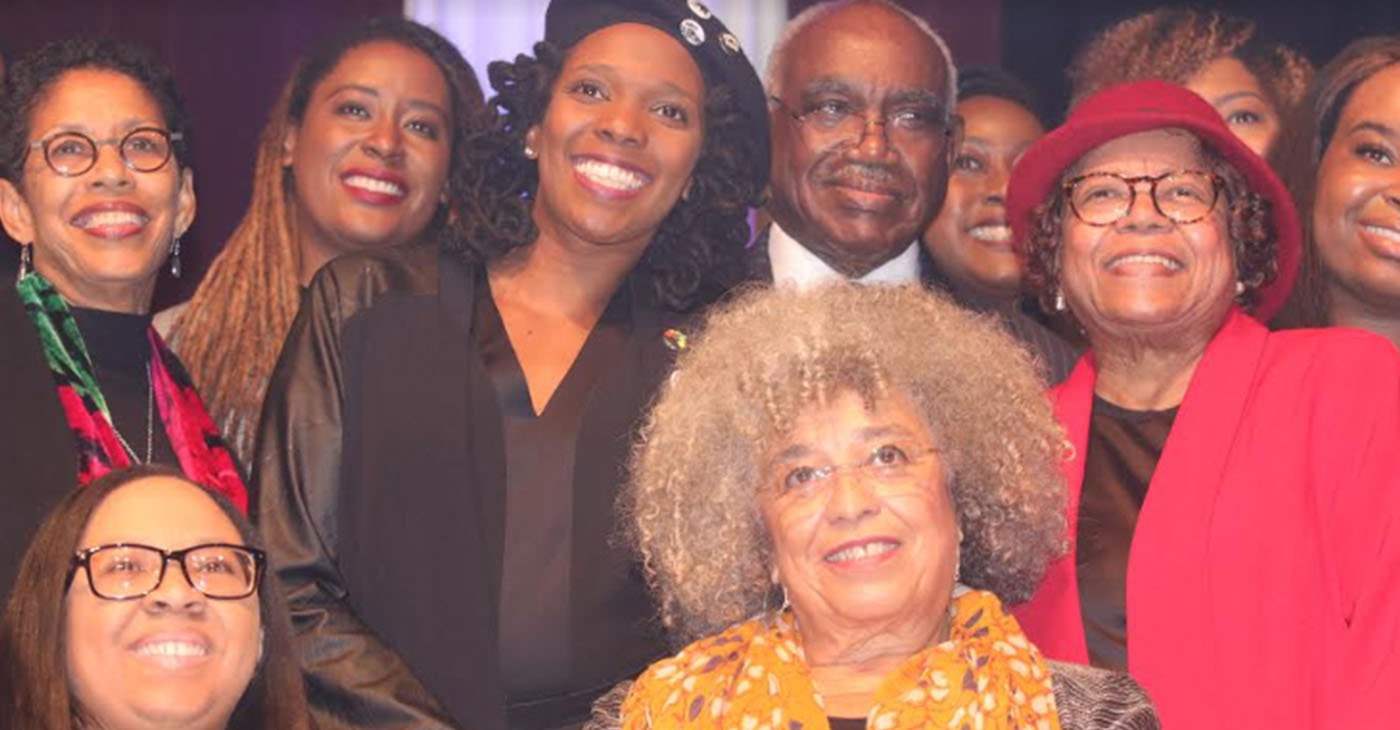 Dr. Angela Davis, (seated right) surrounded by members of The Birmingham Committee for Truth and Reconciliation (BCTR), who organized her visit to Birmingham. (Stephonia Taylor McLinn Photo, For The Birmingham Times)