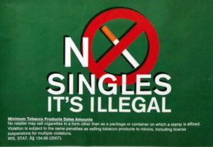 Some store owners are displaying these posters in their stores to decrease and prevent the sales of single cigarettes. (Photo by Ana Martinez-Ortiz)