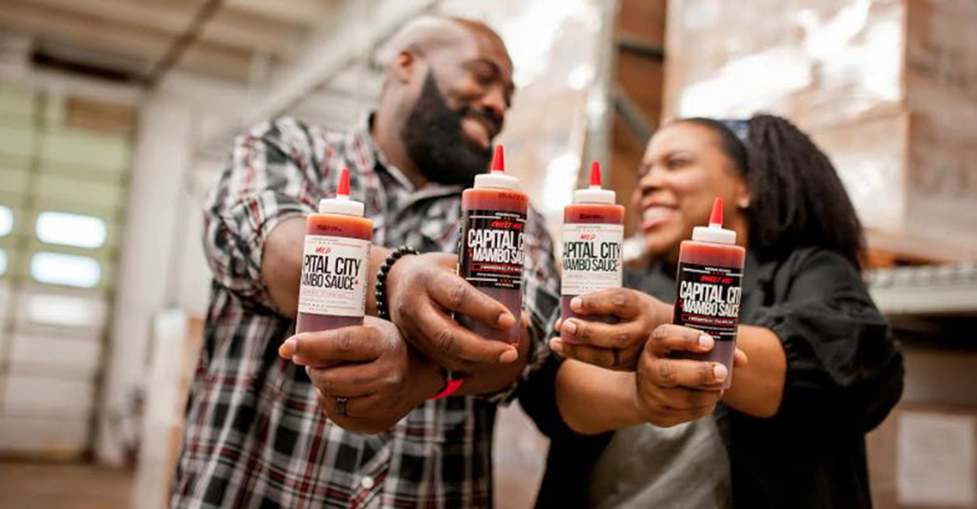 Charles and Arsha Jones are a husband and wife duo that started the brand Capital City Mambo Sauce and recently collaborated with local Papa John’s locations. (Courtesy Photo)