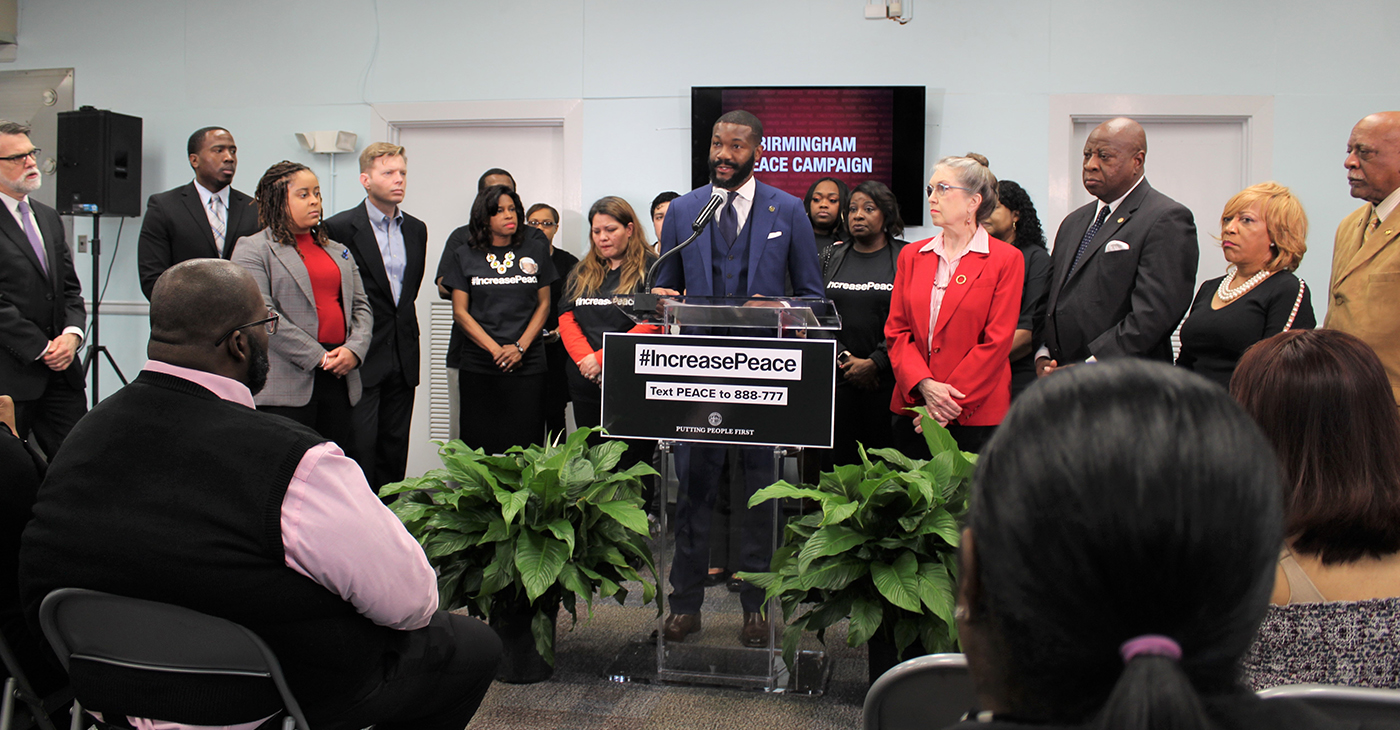Mayor Randall Woodfin (center) speaks during an event unveiling the city's peace plan to end gun violence.. Woodfin has called it a 'public health crisis'. (Ameera Steward Photos, The Birmingham Times)