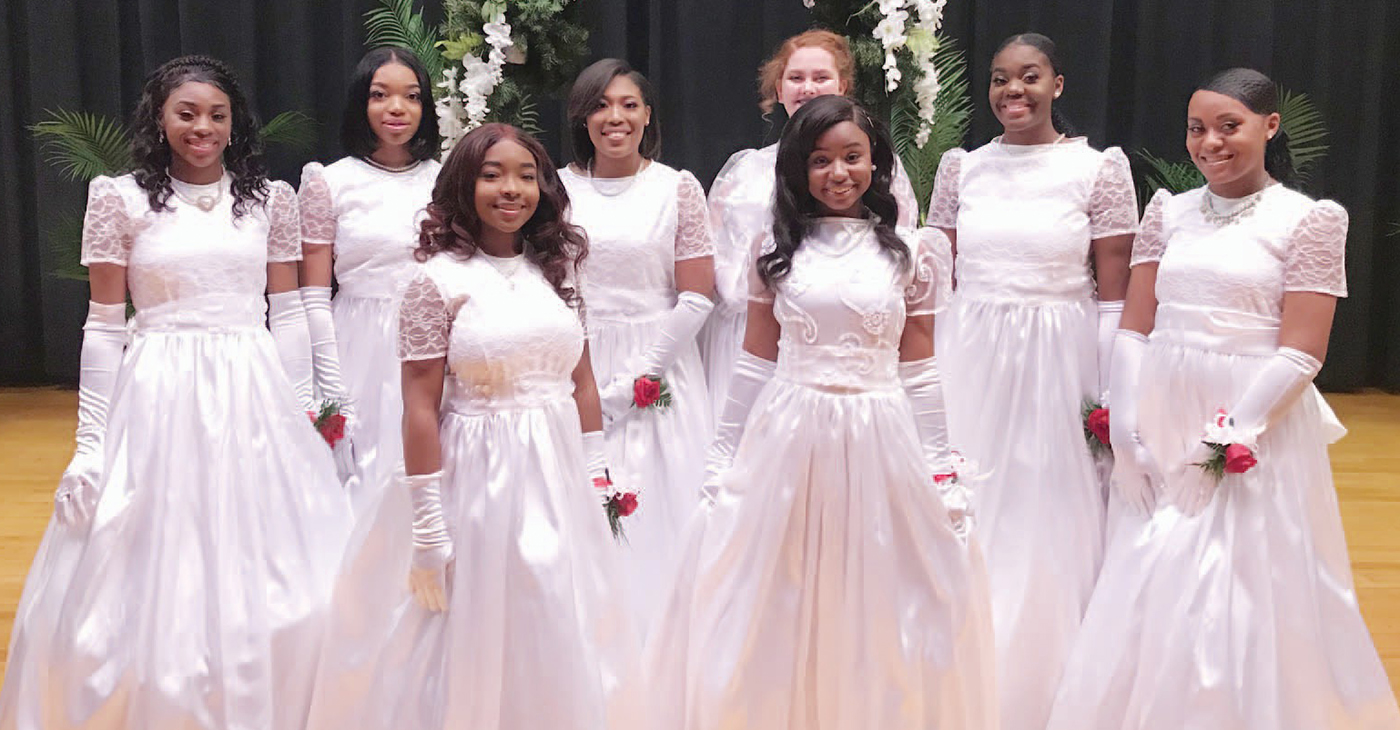 The newest inductees of the 2019 debutante and debonair society stand proudly before being presented to society. Back Row (From left to right): Brikyia Benjamin, Erin Logan Owens, Ar’Nyya Walden, Ivy Jones, Iyana Sharmine Morgan, Naloni Lecal Moore. Front Row (from left to right): Semiyah Patrice Smith and Gabrielle Natania Joseph