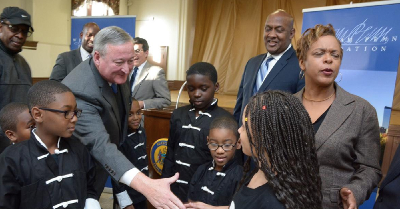 In this Tribune file photo, Mayor Jim Kenney greets Michelle Ramos, a member of the Shaolin Knights, which practices at the Cecil B. Moore Recreation Center in North Philadelpha. The recreation center will be revamped as part of the Rebuild initative - (Photo By: Abdul Sularyman/Tribne Chief Photgrapher)