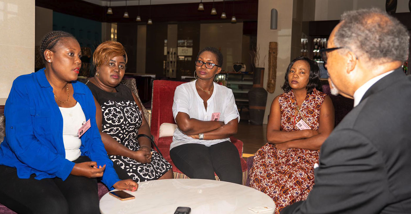 NNPA President and CEO, Dr Benjamin F. Chavis, Jr., (far right) invited Kettie Kamwangala (far left) and other Malawian women leaders for an open discussion while the ballots were being counted after a historic voter turnout across Malawi.