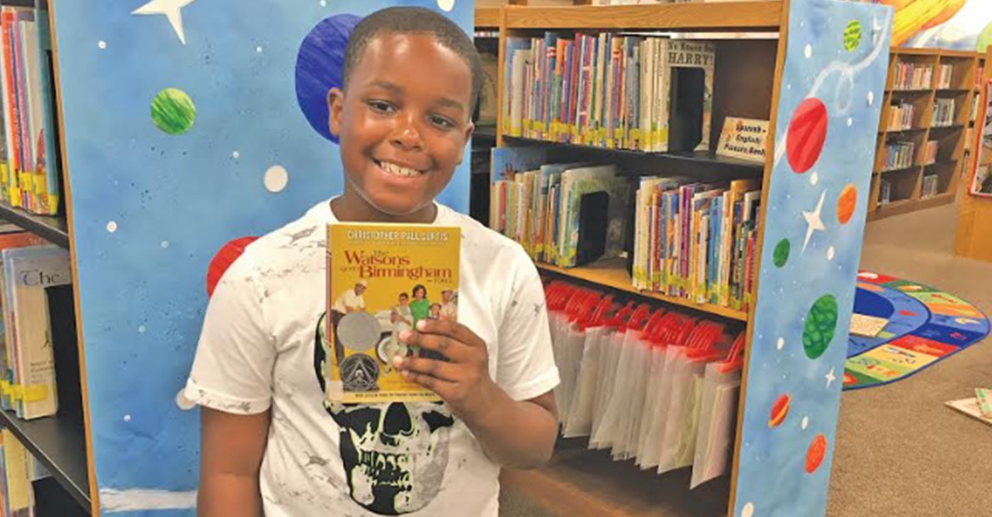 Dalvin McCollum, 10, used his love of comics to create a newspaper, "B'HAM NEWS," that included an article, a drawing of the 16th Street Baptist Church, and a comic strip based on "The Watsons Go to Birmingham 1963." (Photo by: Kathryn Sesser-Dorne | The Birmingham Times)