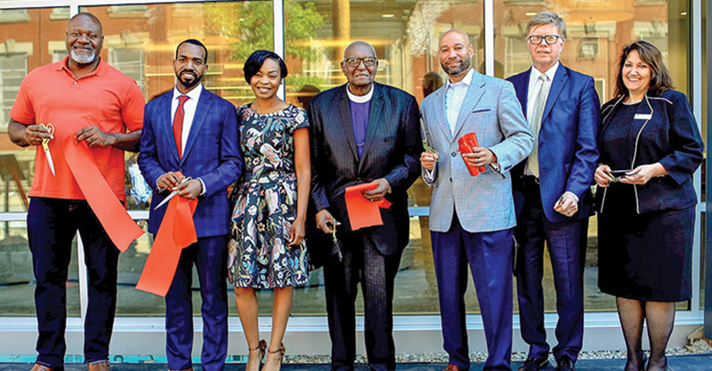 THE PARTNERSHIP—Those involved in the Miller Street development include state Rep. Jake Wheatley, Derrick and Nykia Tillman, Bishop James M. Foster, Pittsburgh Councilman R. Daniel Lavelle, Bob Meeder and Lisa Kelly. (Photo by Emmai Alaquiva)