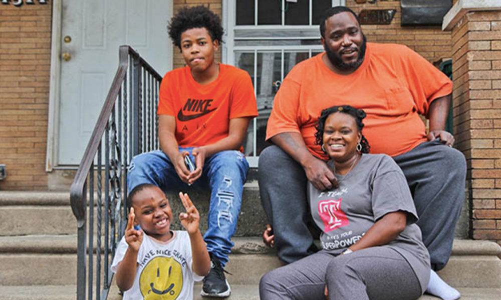 Janel Turner, (bottom right), her husband, and two of her sons, at their home in Philadelphia’s Nicetown neighborhood. (Kimberly Paynter/WHYY)