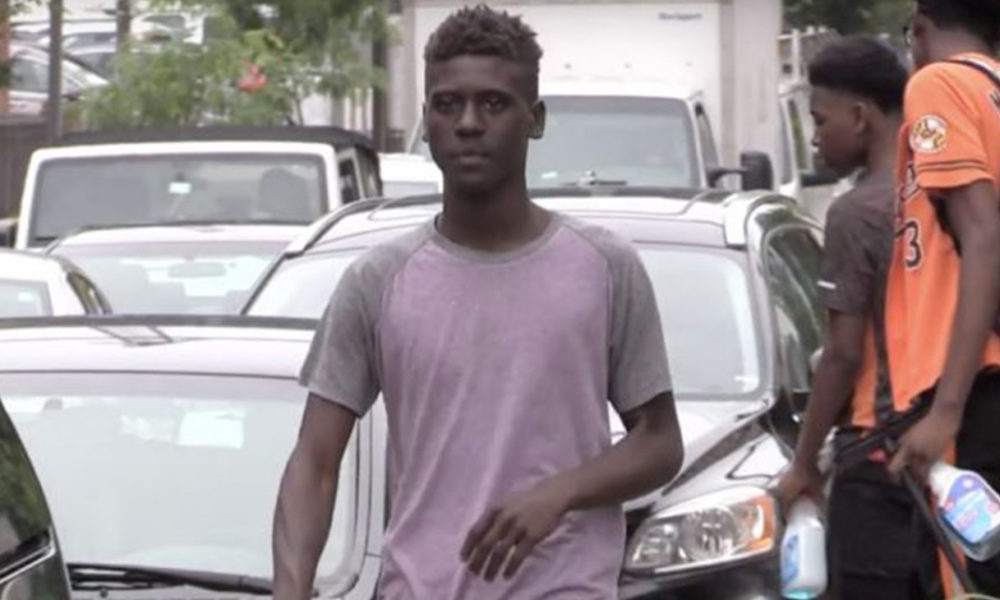 “Makai” a so-called Squeegee Kid told the AFRO he washes car windows because, “I have a mother struggling with so many bills.” (Photo courtesy: Stephen Janis)