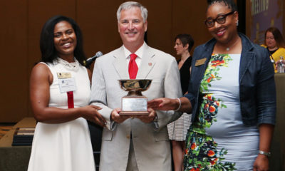 PHOTO: GABWA President Liz Brown (L) and Past President Rita M. Treadwell accept the President’s Cup from 2018-19 State Bar of Georgia President Kenneth B. Hodges III. (Photo by Sarah Coole/State Bar of Georgia)