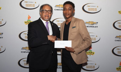 Chevrolet Discover the Unexpected Fellow, Elae Hill (pictured right), is pictured with NNPA President and CEO, Dr. Benjamin F. Chavis Jr.