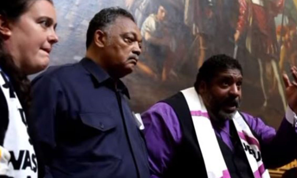 Rev. Dr. Liz Theoharis, Rev. Jesse Jackson Sr. and Rev. Dr. William Barber II