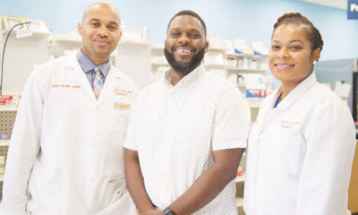 Customer Bernard Macon (center) is shown with Vincent and Lekeisha Williams, owners of LV Health and Wellness Pharmacy in Shiloh, Illinois.