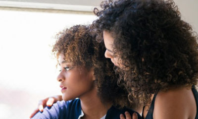 Young woman consoling her friend. Los Angeles, America. (Photo by: wavenewspapers.com)