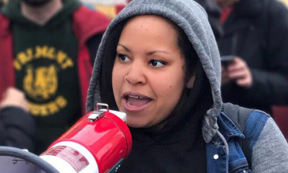 Megan Bumpus speaks on bullhorn during this year’s Oakland teachers strike. (Photo courtesy of Megan Bumpus.)