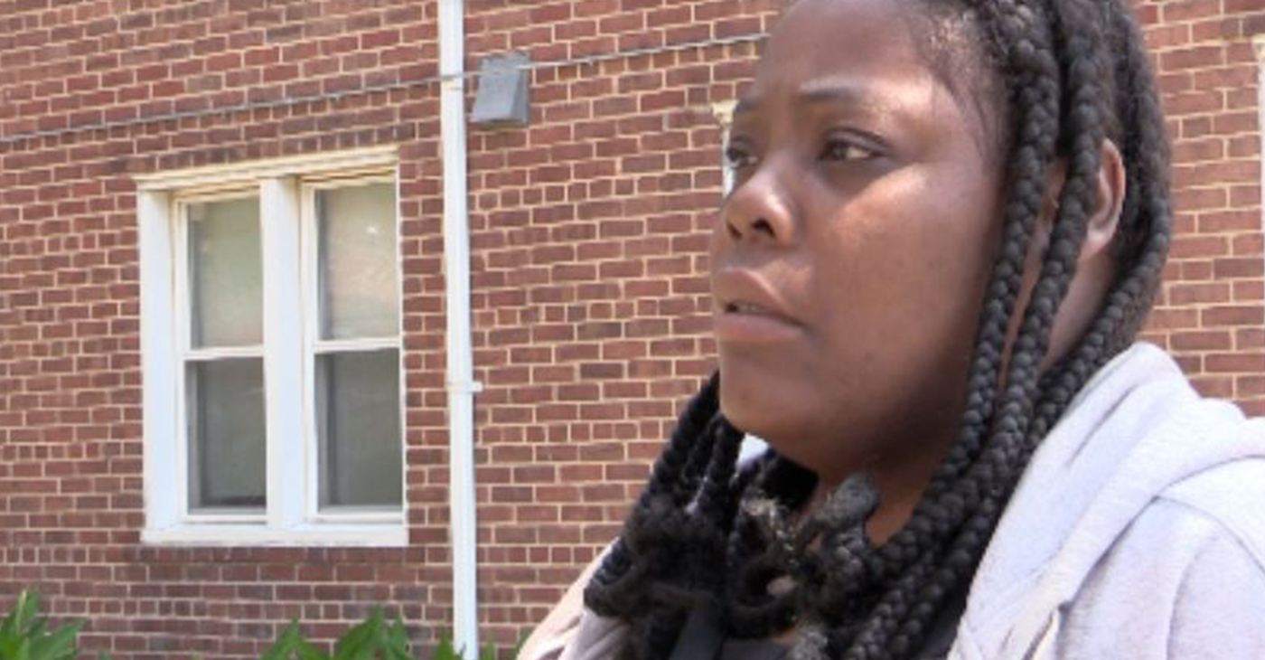 Shanelle, is one of the residents of Poe Homes, the West Baltimore housing project, which experienced a crippling water outage last week. (Photo Credit: Stephan Janis)