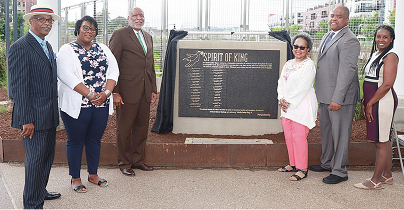 The Port Authority rededicated the Spirit of King plaque near the East Liberty Busway, June 19. Pictured are Edward Greene, Ashley Johnson, Malik Bankston, Gwendolyn Allen, Eric Wells, and Evelyn Newsome. (Photo by J.L. Martello)