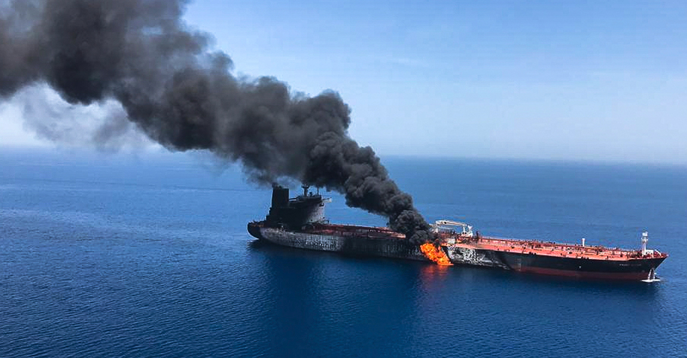 An oil tanker is on fire in the sea of Oman, June 13. Two oil tankers near the strategic Strait of Hormuz were reportedly attacked on June 13, an assault that left one ablaze and adrift as sailors were evacuated from both vessels and the U.S. Navy rushed to assist amid heightened tensions between Washington and Tehran. Photo: AP/Wide World Photo