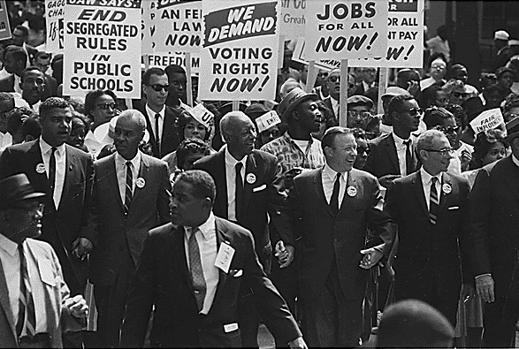 The Civil Rights March on Washington, D.C. — Leaders marching from the Washington Monument to the Lincoln Memorial, August 28, 1963. In the front row, from left are: Whitney M. Young, Jr., Executive Director of the National Urban League; Roy Wilkins, Executive Secretary of the National Association for the Advancement of Colored People (NAACP). A. Philip Randolph, Brotherhood of Sleeping Car Porters, American Federation of Labor (AFL), and a former vice president of the American Federation of Labor and Congress of Industrial Organizations (AFL-CIO). Walter P. Reuther, President, United Auto Workers Union. Arnold Aronson, Secretary of the Leadership Conference on Civil Rights.