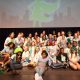 Members of the G.I.R.L. Squad, GSNCA’s media team who helped plan and lead the event, pose on stage with astronaut and Girl Scout alum Jan Davis. (Provided)