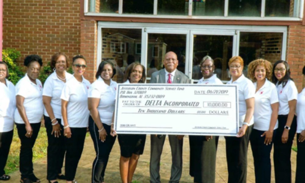 Senator Rodger Smitherman (Center) with members of DELTA Inc. (Courtesy Photo)