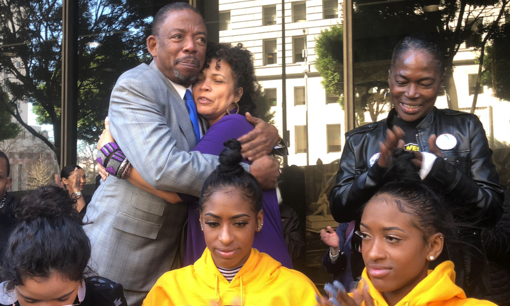Attorney Carl Douglas hugs Black Lives Matter leader Dr. Melina Abdullah (Courtesy Photo)