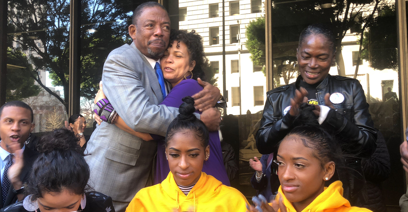 Attorney Carl Douglas hugs Black Lives Matter leader Dr. Melina Abdullah (Courtesy Photo)