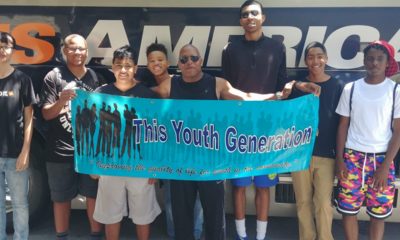 From left to right: Roman, Jimmy, J.J., Amir, Gabriel, Elijah and Chris pose with Deon D. Price, founder and executive director of This Youth Generation. The boys will board a bus headed to YMCA summer camp at Jones Gulch in La Honda for the 3rd year.