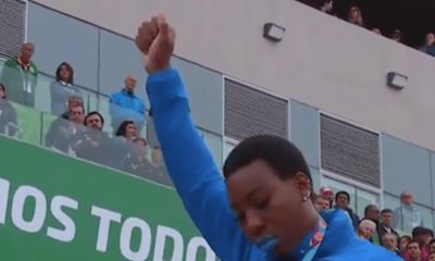 Gwen Berry protests at the Pan Am Games. (Screen grab courtesy of DiversityInc)