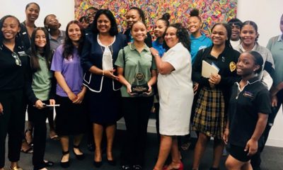 Kamala Harris’ State Director Heather and Brotherhood Crusade president Charisse Bremond with the young ladies as they tour the office.