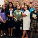 Kamala Harris’ State Director Heather and Brotherhood Crusade president Charisse Bremond with the young ladies as they tour the office.