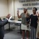 Micheal Bryant, former Martin University Alumni Association president, swore in (left to right) Linda Bellamy-Sims, Ann Pimpton and Dorothy Herron as new officers Aug. 24. (Photo by: Jim Buntin)