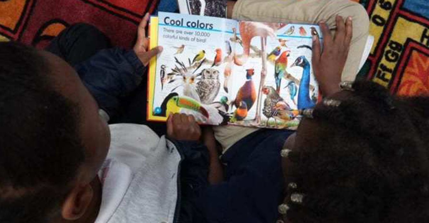 Student read a book during a reading circle at Gardenview Elementary School in Memphis, Tennessee. (Photo: Karen Pulfer Focht/Chalkbeat TÑ)