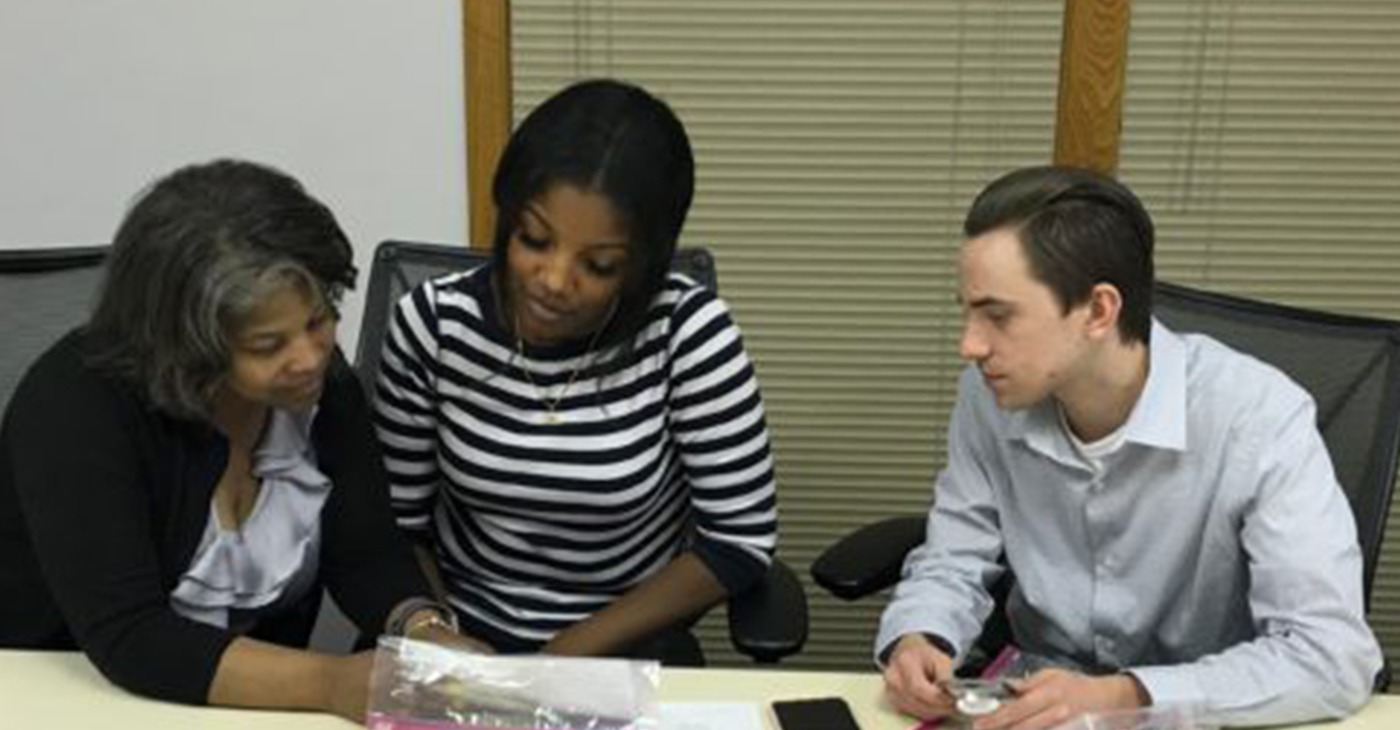 April Williams-Luster, Elise Miller and Kyle Bergfors examine a Narcan kit after a training session on how to administer the opioid overdose reversal spray at the Matteson office of Congresswoman Robin Kelly. The training session was conducted by Lindsay Wilson, health promotions coordinator with the Kankakee County Health Department.