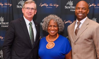 (From left to right) Bill Rogers, Chairman and CEO, SunTrust Bank, and Chairman, SunTrust Foundation; Monica Kaufman Pearson, renowned Atlanta television broadcast journalist; and Stan Little, President, SunTrust Foundation, honor the winners of the SunTrust Foundation’s Lighting the Way Awards. (Photo by: newsroom.suntrust.com)