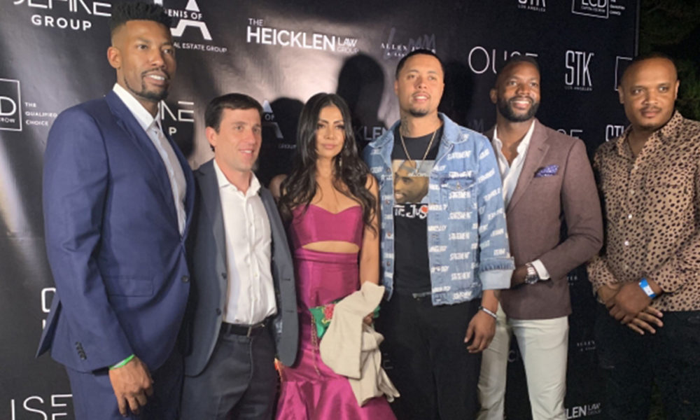 Erik Miles (left) of VH1’s Love & Listings takes a photo with some of his clients at the Love & Listings launch party. (Photo Credit: Shannen Hill)