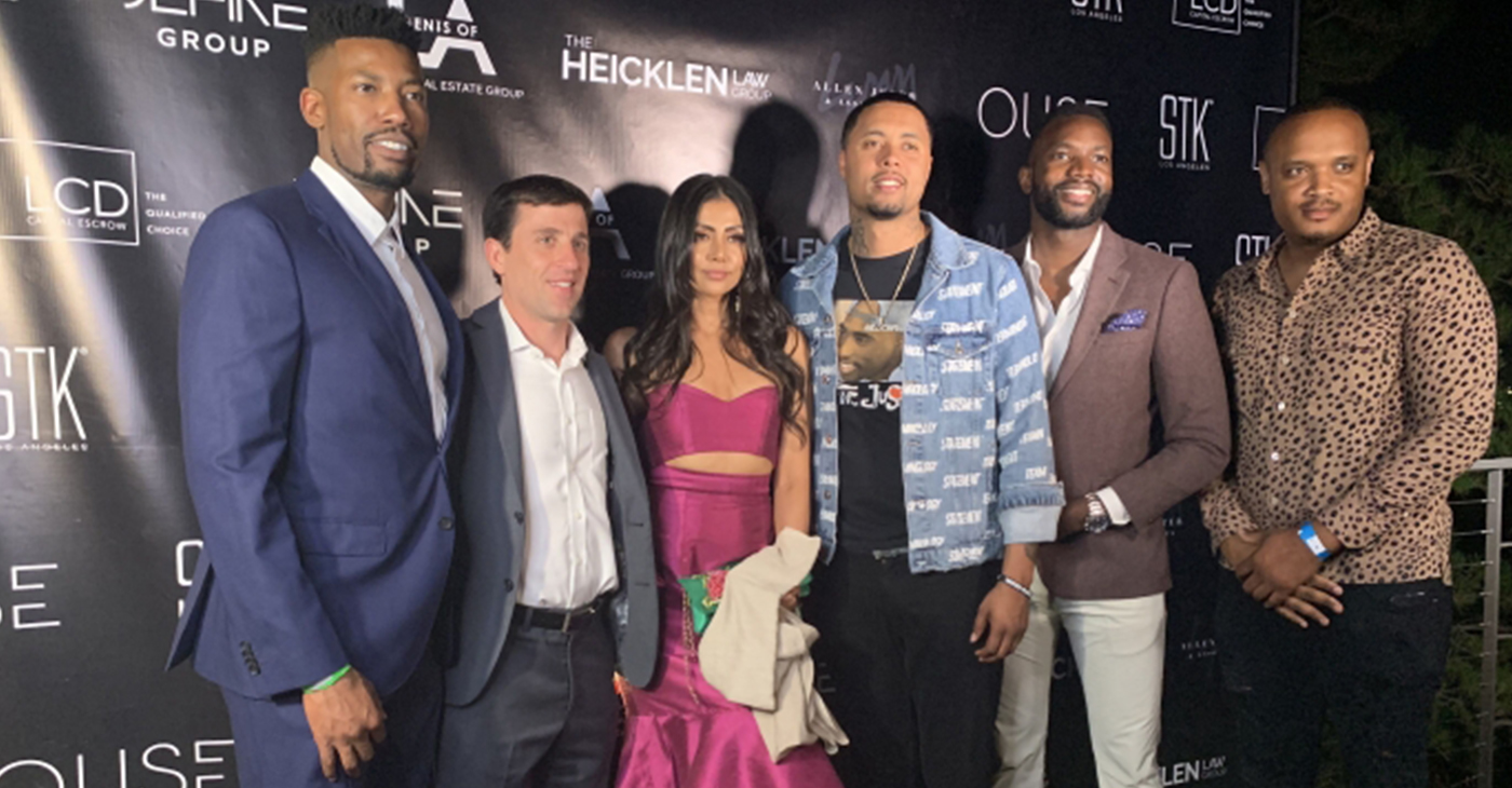 Erik Miles (left) of VH1’s Love & Listings takes a photo with some of his clients at the Love & Listings launch party. (Photo Credit: Shannen Hill)